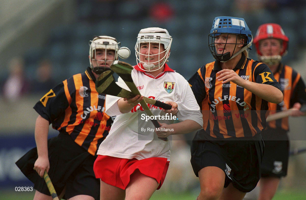 7 August 1999; Miriam Deasy of Cork in action against Tracey Millea of Kilkenny during the Bórd na Gaeilge All-Ireland Senior Camogie Championship Semi-Final match between Kilkenny and Cork at Parnell Park in Dublin. Photo by Ray McManus/Sportsfile