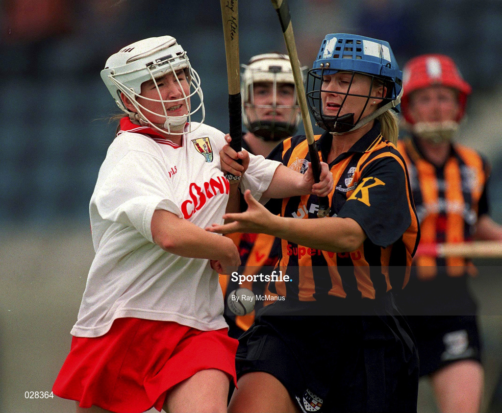 7 August 1999; Miriam Deasy of Cork in action against Tracey Millea of Kilkenny during the Bórd na Gaeilge All-Ireland Senior Camogie Championship Semi-Final match between Kilkenny and Cork at Parnell Park in Dublin. Photo by Ray McManus/Sportsfile