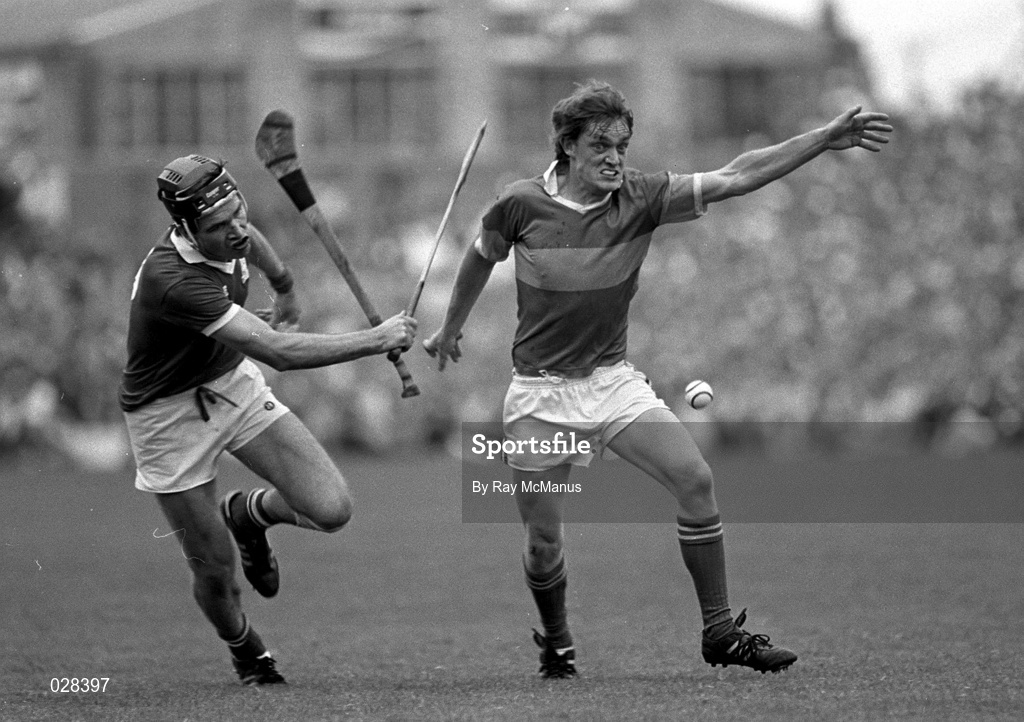 12 July 1987; Nicky English, Tipperary, after losing his hurl, in action against Cork's Richard Browne during the Munster Senior Hurling Championship Final between Tipperary and Cork at Semple Stadium in Thurles, Tipperary. Photo by Ray McManus/Sportsfile
