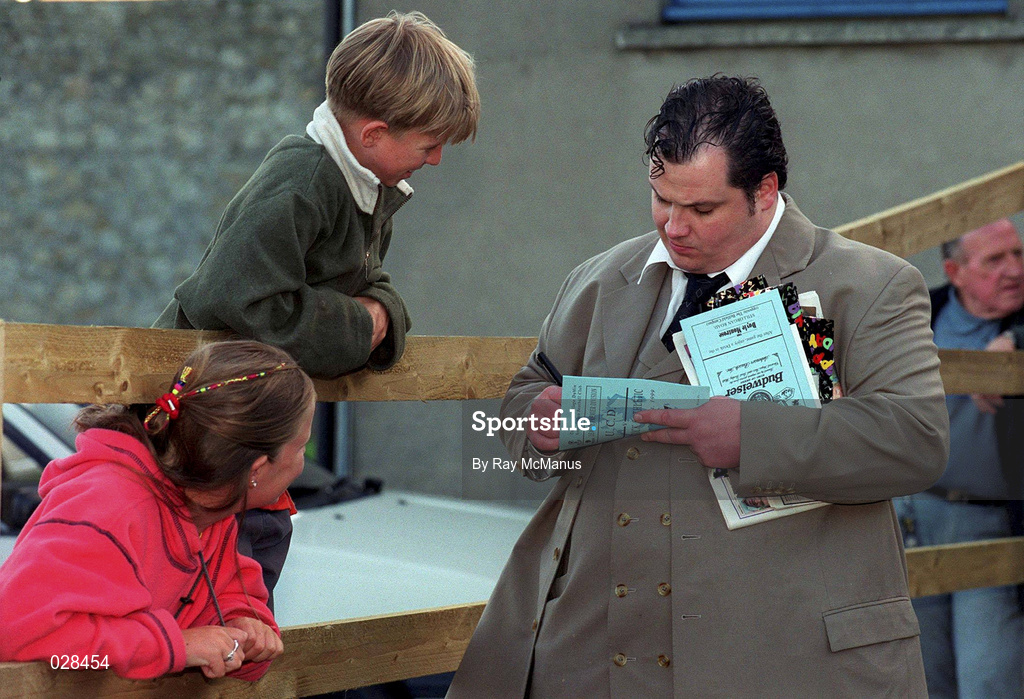 20 August 1999; St Patrick's Athletic managing director Pat Dolan signs an autograph for a supporter prior to the Eircom League Premier Division match between UCD and St Patrick's Athletic at Belfield Park in Dublin. Photo by Ray McManus/Sportsfile