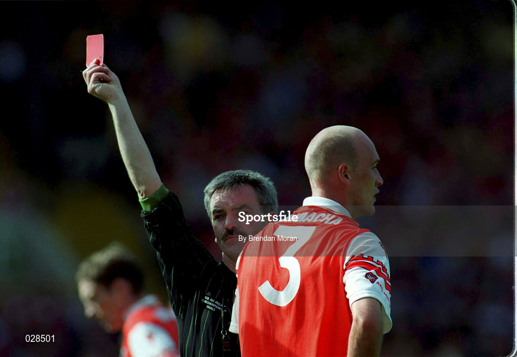 29 August 1999; Referee Paddy Russell issues a red card to Gerard Reid of Armagh during the Bank of Ireland All-Ireland Senior Football Championship Semi-Final match between Meath and Armagh at Croke Park in Dublin. Photo by Brendan Moran/Sportsfile