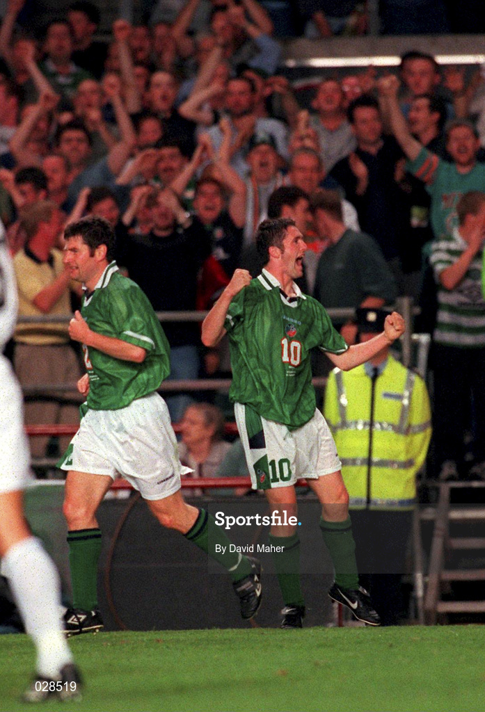 1 September 1999; Robbie Keane celebrates after scoring the Republic of Ireland's opening goal, alongside team-mate Denis Irwin, left, during the UEFA European Championships Qualifying Group 8 match between Republic of Ireland and Yugoslavia at Lansdowne Road in Dublin. Photo by David Maher/Sportsfile