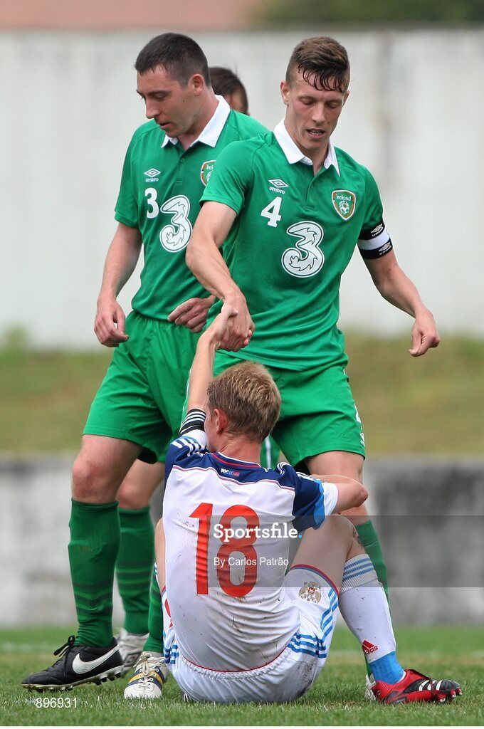 2 August 2014; Ireland's Luke Evans helps Alexandre Kuligin, Russia, up off the ground during the game. 2014 CPISRA Football 7-A-Side European Championship 3rd/4th Place Play-Off, Ireland v Russia, Maia, Portugal. Picture credit: Carlos Patrão / SPORTSFILE