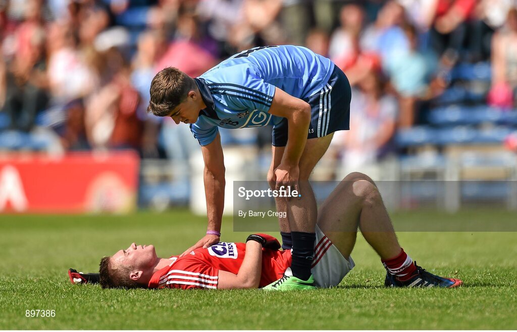 4 August 2014; A dejected Kevin Flahive, Cork, is consoled by Chris Sallier, Dublin after the game. Electric Ireland GAA Football All-Ireland Minor Championship Quarter-Final, Dublin v Cork, Semple Stadium, Thurles, Co. Tipperary. Picture credit: Barry Cregg / SPORTSFILE