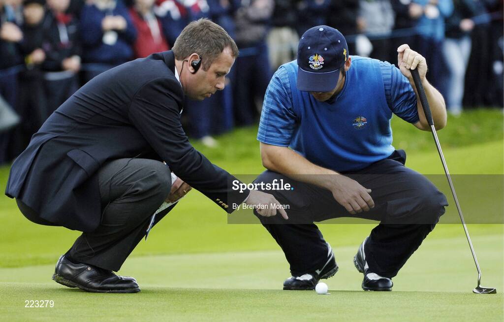 23 September 2006; Paul Casey, Team Europe 2006, in discussion with Rules Official Stephen Cox after his ball rolled back while placing it on the marker on the 4th green during Saturday morning's four-ball matches. 36th Ryder Cup Matches, K Club, Straffan, Co. Kildare, Ireland. Picture credit: Brendan Moran / SPORTSFILE