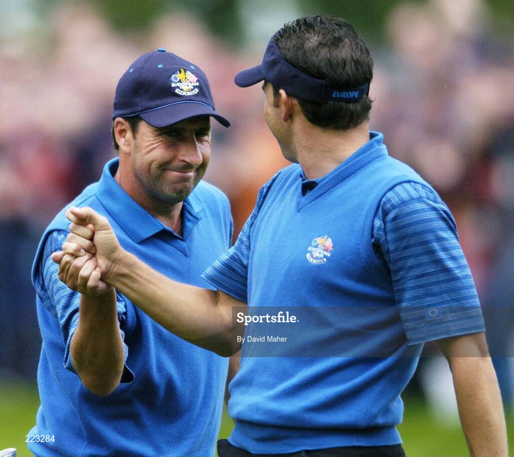 23 September 2006; Jose Maria Olazabal, left, Team Europe 2006, is congratulated by playing partner Sergio Garcia after a putt on the fifth green during Saturday morning's four-ball matches. 36th Ryder Cup Matches, K Club, Straffan, Co. Kildare, Ireland. Picture credit: David Maher / SPORTSFILE