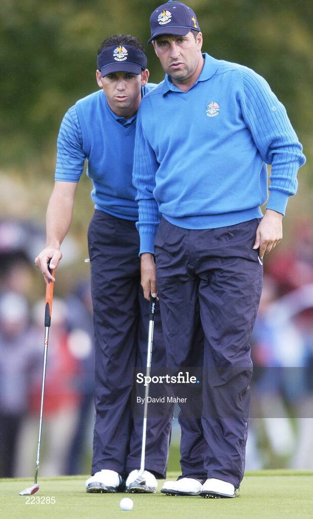 23 September 2006; Team Europe 2006 playing partners Sergio Garcia, left, and Jose Maria Olazabal look at the lie on the fifth green during Saturday morning's four-ball matches. 36th Ryder Cup Matches, K Club, Straffan, Co. Kildare, Ireland. Picture credit: David Maher / SPORTSFILE