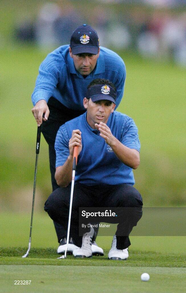 23 September 2006; Sergio Garcia, front, Team Europe 2006, lines up a putt with the help of playing partner Jose Maria Olazabal on the first green during Saturday morning's four-ball matches. 36th Ryder Cup Matches, K Club, Straffan, Co. Kildare, Ireland. Picture credit: David Maher / SPORTSFILE