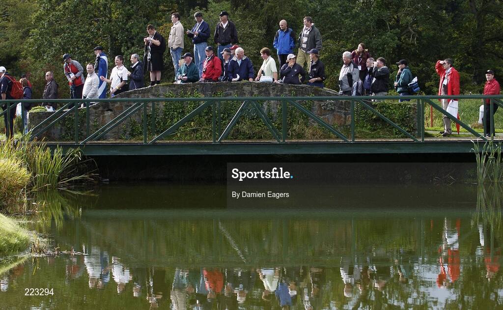 23 September 2006; Golf fans stand on a bridge during Saturday morning's four-ball matches. 36th Ryder Cup Matches, K Club, Straffan, Co. Kildare, Ireland. Picture credit: Damien Eagers / SPORTSFILE
