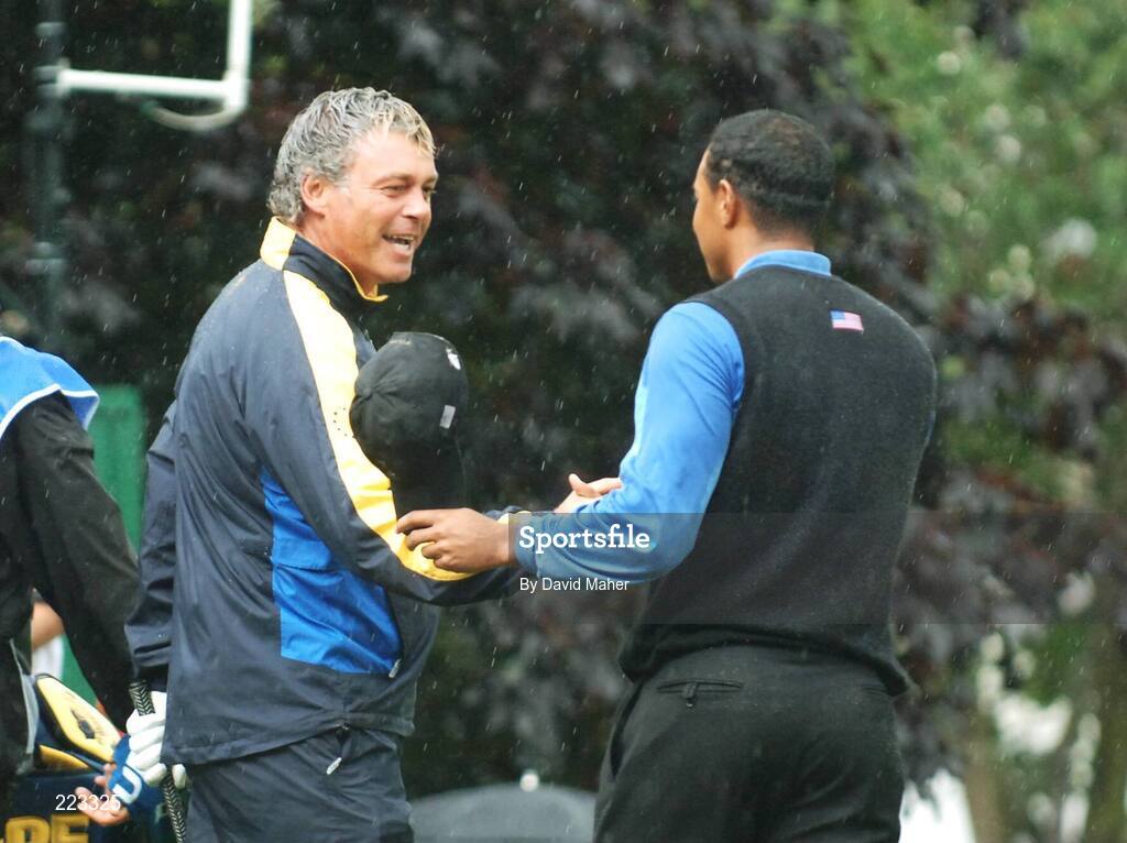 23 September 2006; Darren Clarke, left, Team Europe 2006, is congratulated by Tiger Woods, Team USA 2006, after his birdie chip on the 16th hole for victory over Woods / Furyk during Saturday morning's four-ball matches. 36th Ryder Cup Matches, K Club, Straffan, Co. Kildare, Ireland. Picture credit: David Maher / SPORTSFILE
