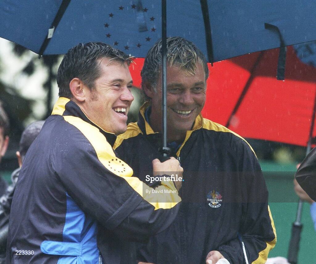23 September 2006; Team Europe 2006 playing partners Lee Westwood, left, and Darren Clarke celebrate after Clarke chiped straight in to the hole on the 16th for victory over Woods / Furyk during Saturday morning's four-ball matches. 36th Ryder Cup Matches, K Club, Straffan, Co. Kildare, Ireland. Picture credit: David Maher / SPORTSFILE
