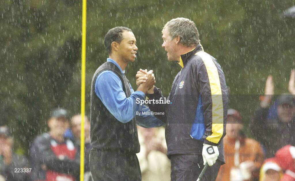 23 September 2006; Darren Clarke, Team Europe 2006, is congratulated by Tiger Woods, Team USA 2006, after his birdie chip at the 16th hole for victory over Woods / Furyk during Saturday morning's four-ball matches. 36th Ryder Cup Matches, K Club, Straffan, Co. Kildare, Ireland. Picture credit: Matt Browne / SPORTSFILE