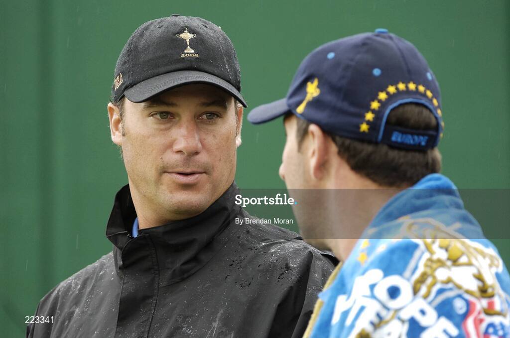 23 September 2006; Chris Di Marco, left, Team USA 2006, in conversation with Jose Maria Olazabal, Team Europe 2006, on the 18th green after finishing their respective matches during Saturday morning's four-ball matches. 36th Ryder Cup Matches, K Club, Straffan, Co. Kildare, Ireland. Picture credit: Brendan Moran / SPORTSFILE