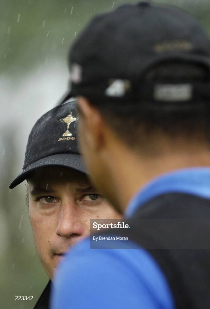 23 September 2006; Chris DiMarco, Team USA 2006, looks across at team-mate Tiger Woods on the 18th green during Saturday morning's four-ball matches. 36th Ryder Cup Matches, K Club, Straffan, Co. Kildare, Ireland. Picture credit: Brendan Moran / SPORTSFILE