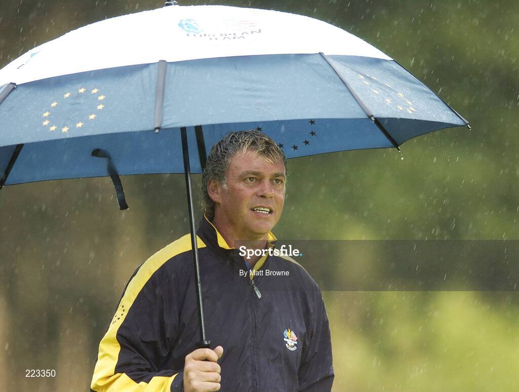 23 September 2006; Darren Clarke, Team Europe 2006, under an umbrella during Saturday morning's four-ball matches. 36th Ryder Cup Matches, K Club, Straffan, Co. Kildare, Ireland. Picture credit: Matt Browne / SPORTSFILE