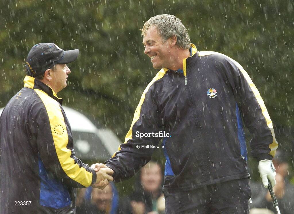 23 September 2006; Darren Clarke, right, Team Europe 2006, shakes hands with team captain Ian Woosnam after his birdie chip on the 16th hole for victory over Woods / Furyk during Saturday morning's four-ball matches. 36th Ryder Cup Matches, K Club, Straffan, Co. Kildare, Ireland. Picture credit: Matt Browne / SPORTSFILE