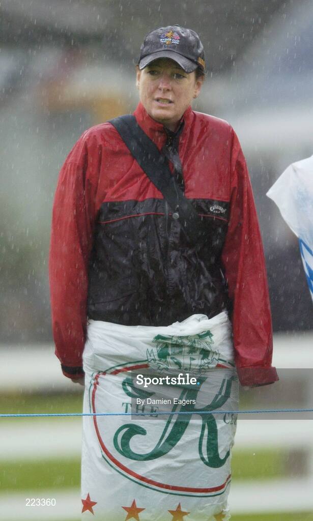23 September 2006; A golf fan stands in a heavy shower during Saturday morning's four-ball matches. 36th Ryder Cup Matches, K Club, Straffan, Co. Kildare, Ireland. Picture credit: Damien Eagers / SPORTSFILE