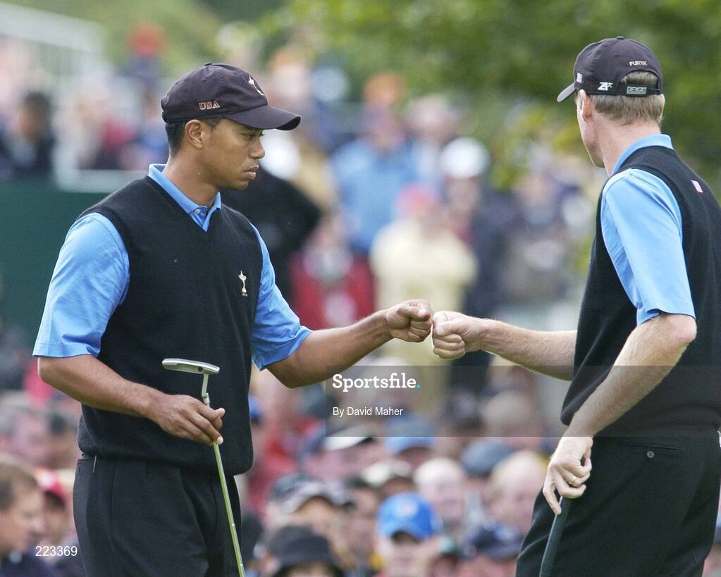 23 September 2006; Team USA 2006 playing partners Tiger Woods, left, and Jim Furyk congratulate each other after Furyk putted to halve the fourth hole during Saturday afternoon's foursomes matches. 36th Ryder Cup Matches, K Club, Straffan, Co. Kildare, Ireland. Picture credit: David Maher / SPORTSFILE