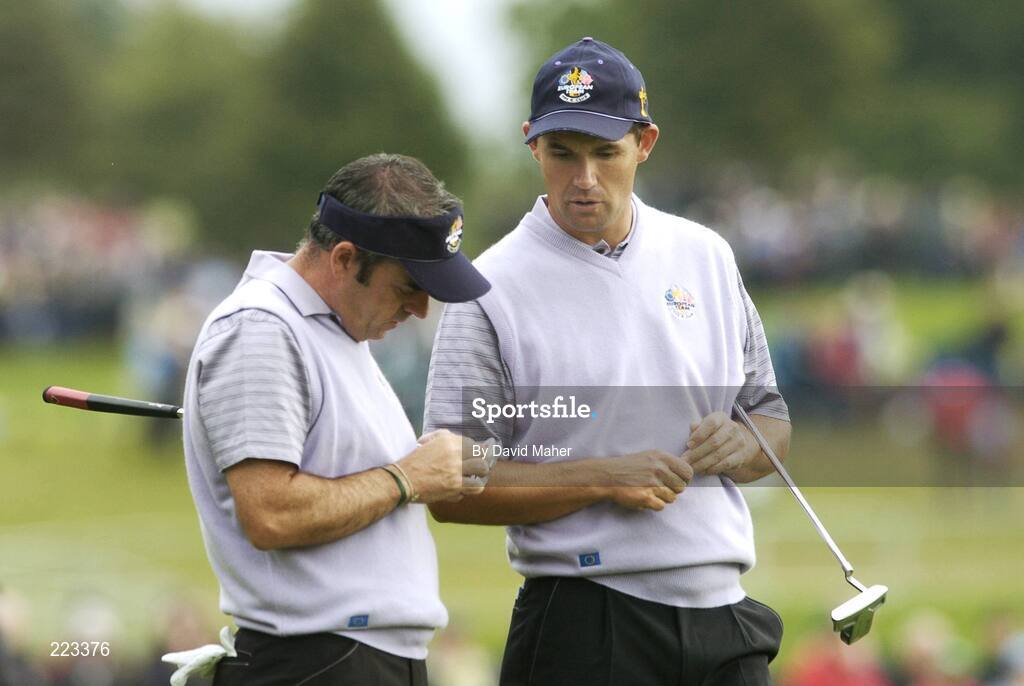 23 September 2006; Team Europe 2006 playing partners Paul McGinley, left, and Padraig Harrington in conversation during Saturday afternoon's foursomes matches. 36th Ryder Cup Matches, K Club, Straffan, Co. Kildare, Ireland. Picture credit: David Maher / SPORTSFILE