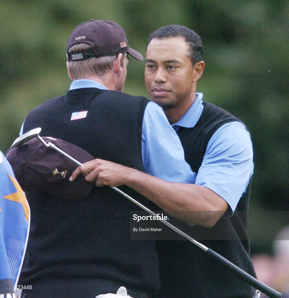 23 September 2006; Tiger Woods, Team USA 2006, with playing partner Jim Furyk, left, after victory over Harrington / McGinley during Saturday afternoon's foursomes matches. 36th Ryder Cup Matches, K Club, Straffan, Co. Kildare, Ireland. Picture credit: David Maher / SPORTSFILE
