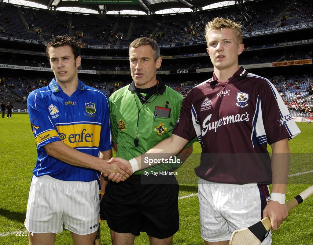 3 September 2006; Galway captain Joe Canning, right, and Tipperary captain Joey McLoughney shake hands in front of referee Dominic Connolly. ESB All-Ireland Minor Hurling Championship Final, Galway v Tipperary, Croke Park, Dublin. Picture credit: Ray McManus / SPORTSFILE