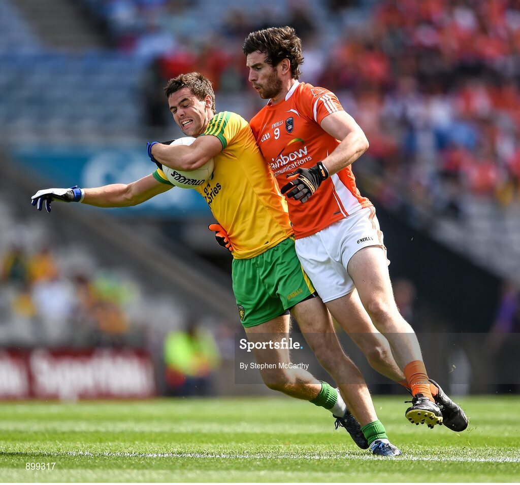 9 August 2014; Odhrn Mac Niallais, Donegal, in action against Aaron Findon, Armagh. GAA Football All-Ireland Senior Championship, Quarter-Final, Donegal v Armagh, Croke Park, Dublin. Picture credit: Stephen McCarthy / SPORTSFILE
