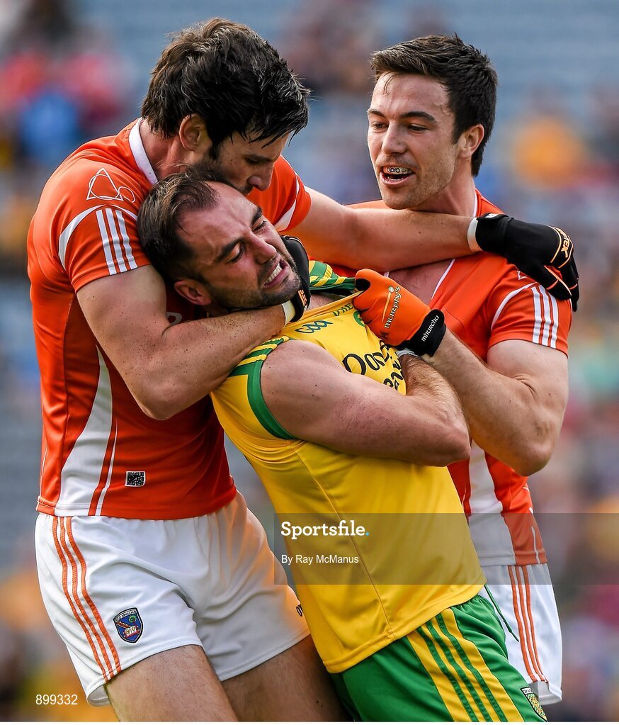 9 August 2014; Armagh's Aaron Findon, left, gets involved, and was later given a yellow card, in the altercation between Karl Lacey, Donegal, and Aidan Forker, Armagh. GAA Football All-Ireland Senior Championship, Quarter-Final, Donegal v Armagh, Croke Park, Dublin. Picture credit: Ray McManus / SPORTSFILE