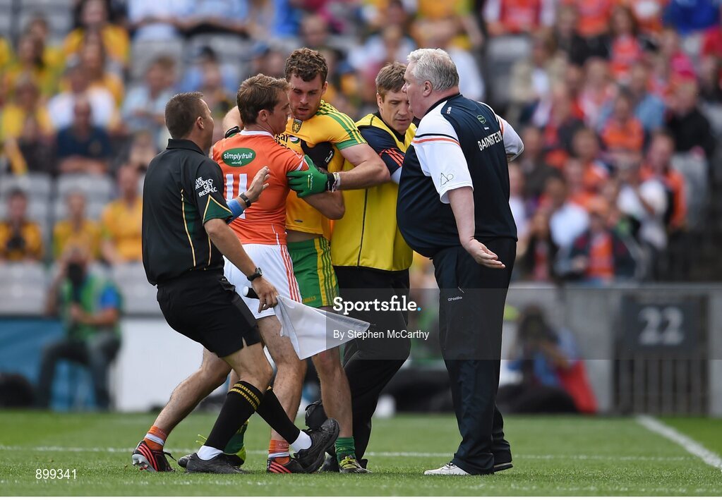 9 August 2014; Armagh manager Paul Grimley and assistant Kieran McGeeney with player Kevin Dyas exchange views with Eamonn McGee, Donegal. GAA Football All-Ireland Senior Championship, Quarter-Final, Donegal v Armagh, Croke Park, Dublin. Picture credit: Stephen McCarthy / SPORTSFILE