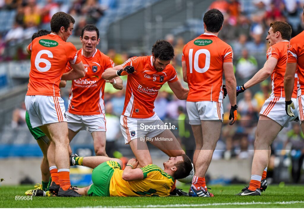 9 August 2014; Players from both sides including Leo McLoone, Donegal, and Aaron Findon, Armagh, during a first half altercation. GAA Football All-Ireland Senior Championship, Quarter-Final, Donegal v Armagh, Croke Park, Dublin. Picture credit: Ray McManus / SPORTSFILE