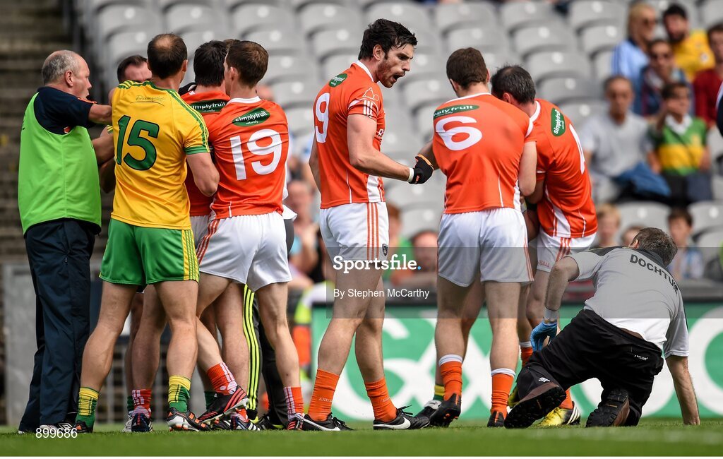 9 August 2014; Aaron Findon, Armagh, and Donegal team doctor Kevin Moran during an altercation in the first half. GAA Football All-Ireland Senior Championship, Quarter-Final, Donegal v Armagh, Croke Park, Dublin. Picture credit: Stephen McCarthy / SPORTSFILE