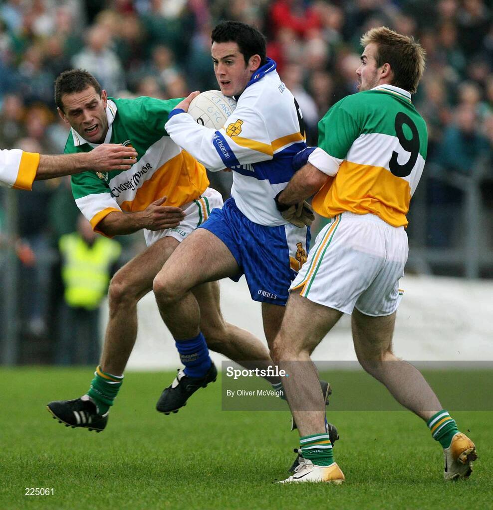 8 October 2006; David Harte, Errigal Ciaran, is tackled by Carrickmore players Gabriel McCallan and Paul Hughes. WJ Dolan Tyrone Senior Football Championship Final Replay, Errigal Ciaran v Carrickmore, Healy Park, Omagh, Co Tyrone. Picture credit: Oliver McVeigh / SPORTSFILE