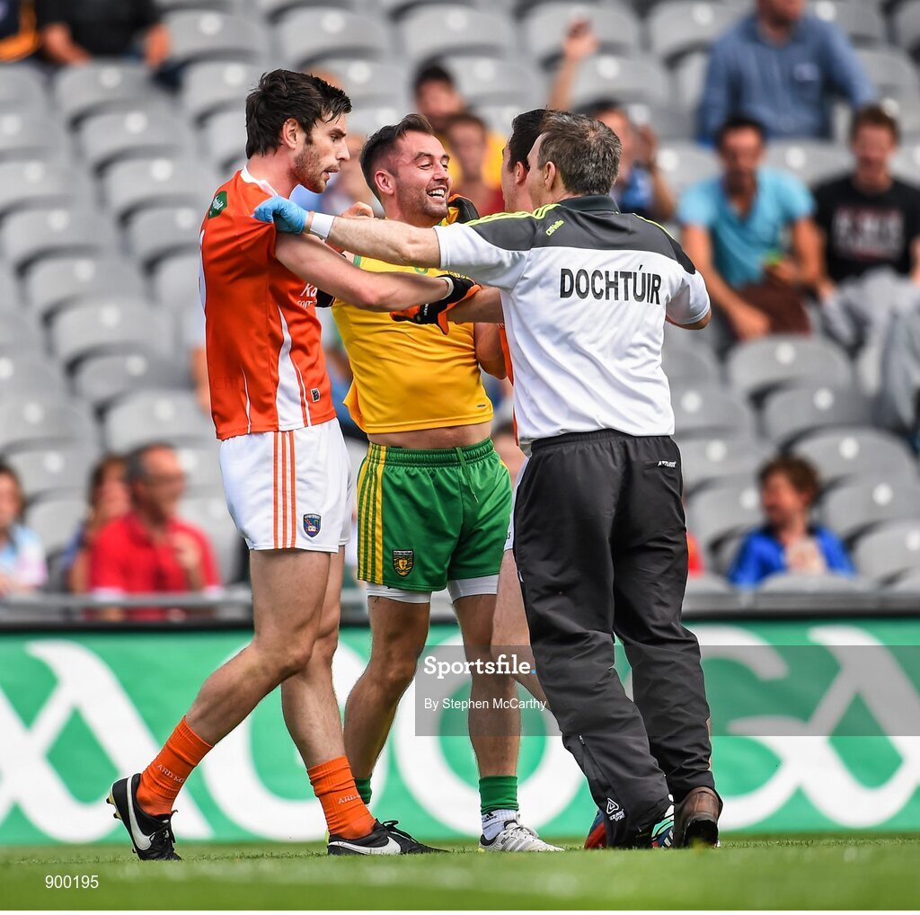 9 August 2014; Donegal team doctor Kevin Moran tries to seperate Armagh's Aaron Findon, left, and Aidan Forker from Donegal's Karl Lacey. GAA Football All-Ireland Senior Championship, Quarter-Final, Donegal v Armagh, Croke Park, Dublin. Picture credit: Stephen McCarthy / SPORTSFILE