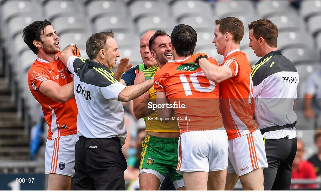 9 August 2014; Donegal team doctor Kevin Moran tries to seperate Armagh's Aaron Findon, left, Aidan Forker and Finnian Moriarty, right, from Donegal's Karl Lacey. GAA Football All-Ireland Senior Championship, Quarter-Final, Donegal v Armagh, Croke Park, Dublin. Picture credit: Stephen McCarthy / SPORTSFILE