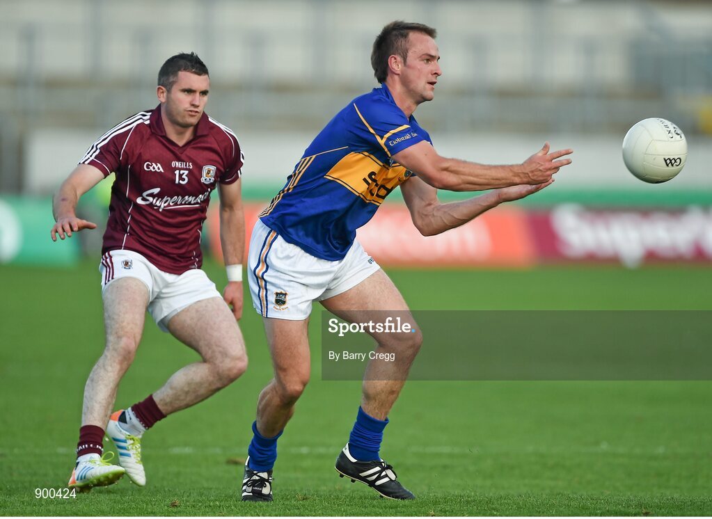 26 July 2014; John Coghlan, Tipperary, in action against Michael Martin, Galway. GAA Football All Ireland Senior Championship, Round 4A, Galway v Tipperary. O'Connor Park, Tullamore, Co. Offaly. Picture credit: Barry Cregg / SPORTSFILE