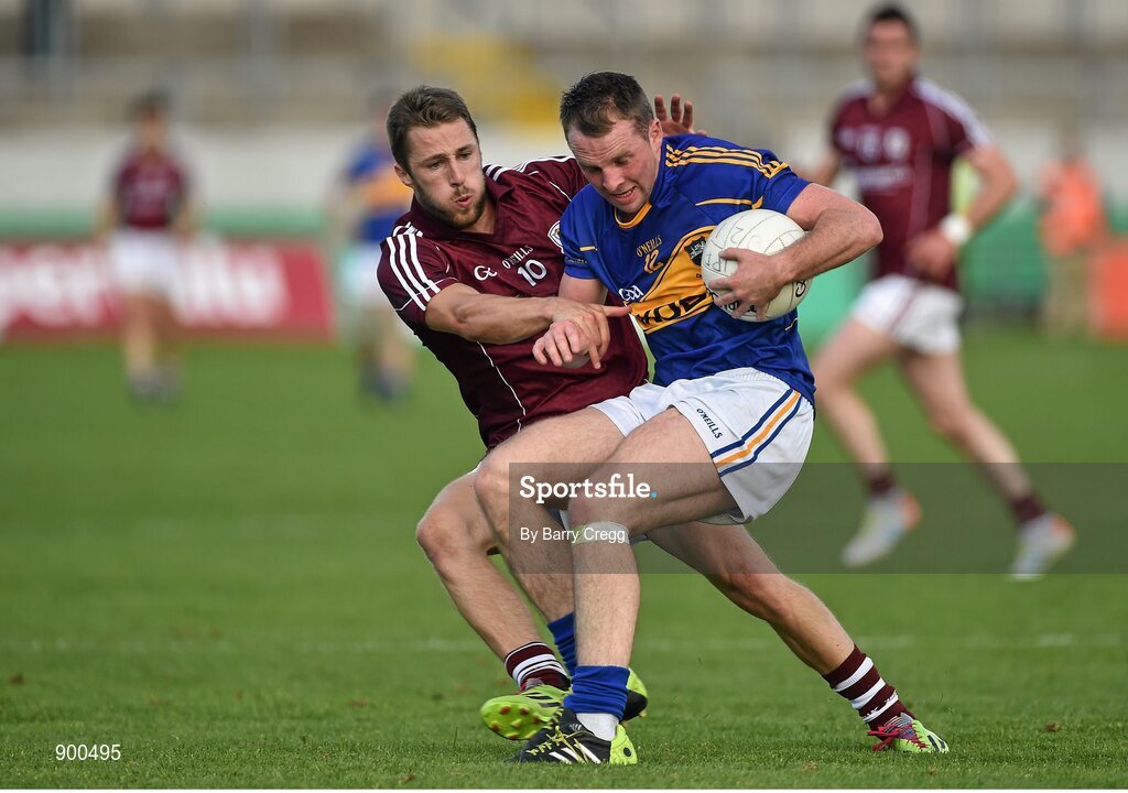 26 July 2014; Peter Acheson, Tipperary, in action against Michael Lundy, Galway. GAA Football All Ireland Senior Championship, Round 4A, Galway v Tipperary. O'Connor Park, Tullamore, Co. Offaly. Picture credit: Barry Cregg / SPORTSFILE