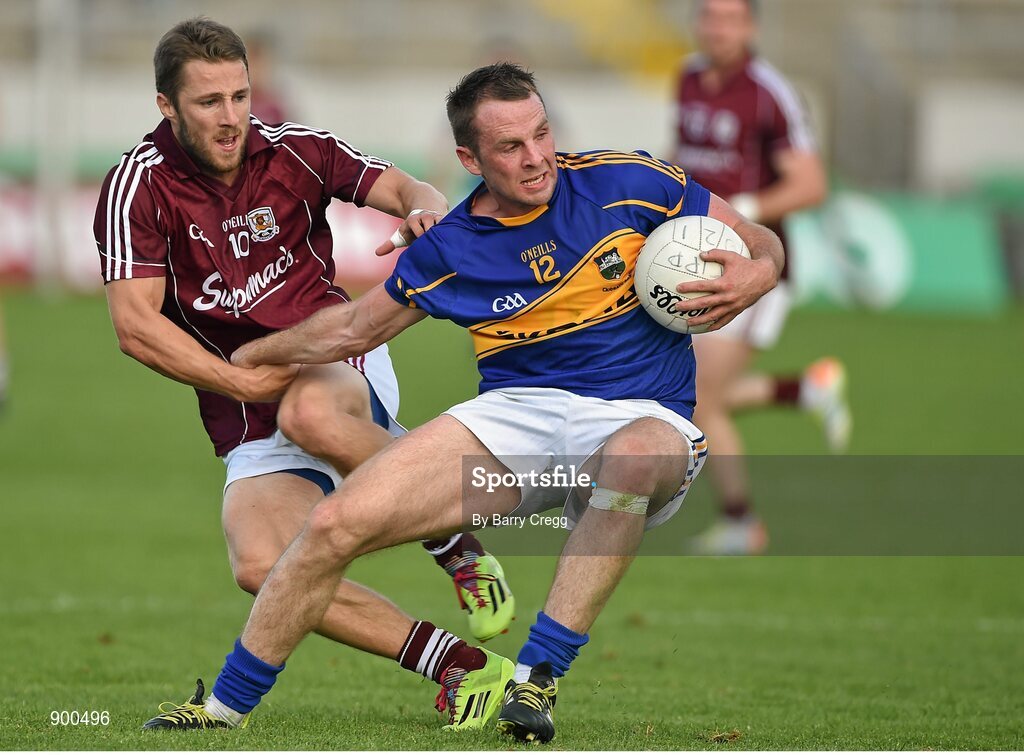 26 July 2014; Peter Acheson, Tipperary, in action against Michael Lundy, Galway. GAA Football All Ireland Senior Championship, Round 4A, Galway v Tipperary. O'Connor Park, Tullamore, Co. Offaly. Picture credit: Barry Cregg / SPORTSFILE