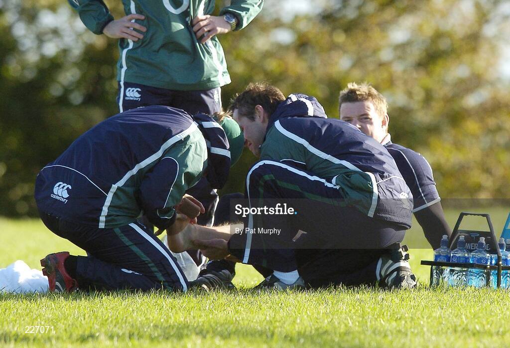 31 October 2006; Brian O'Driscoll has his ankle attended to by Dr. Gary O'Driscoll, team doctor, and Cameron Steele, team physio, right, during Ireland rugby squad training. St. Gerard's School, Bray, Co. Wicklow. Picture credit: Pat Murphy / SPORTSFILE