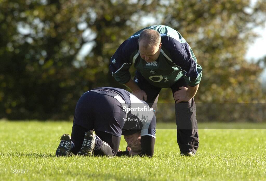 31 October 2006; Brian O'Driscoll lies injured as team massous Willie Bennett checks on his condition masseuse during Ireland rugby squad training. St. Gerard's School, Bray, Co. Wicklow. Picture credit: Pat Murphy / SPORTSFILE