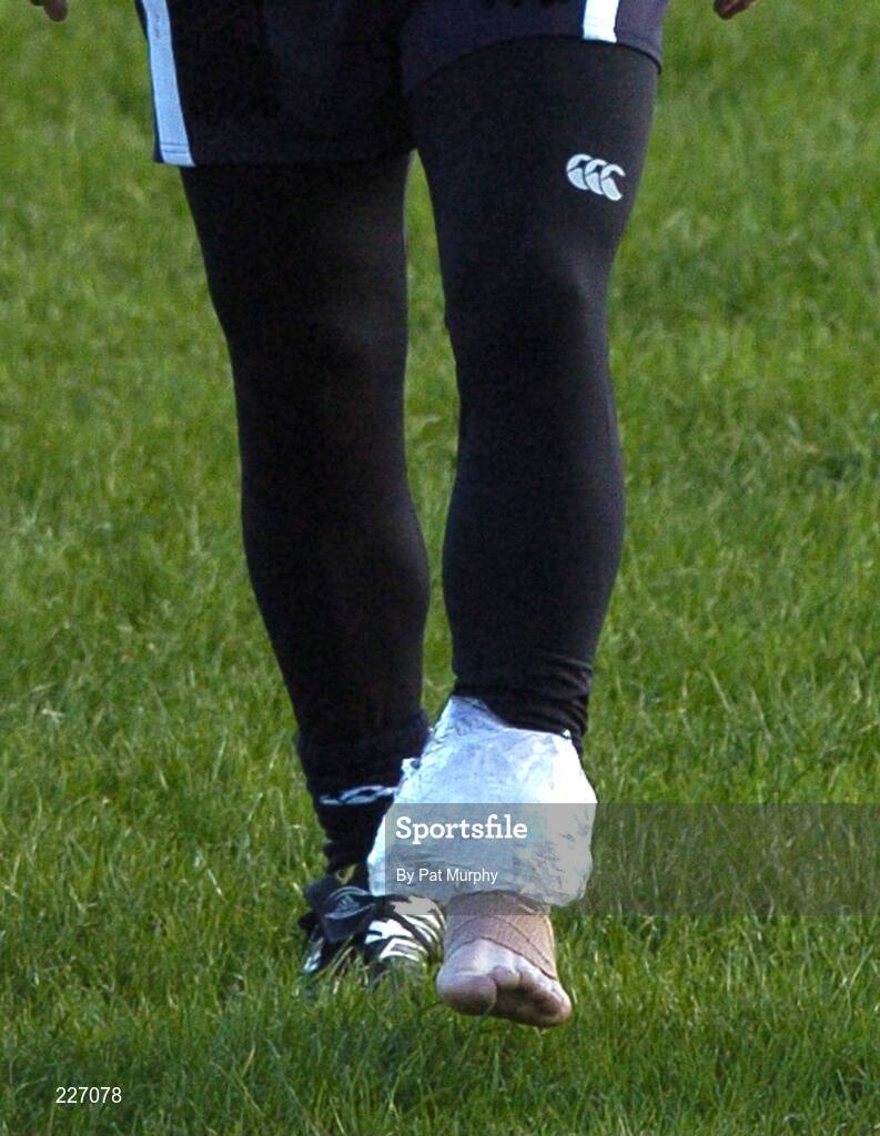 31 October 2006; Brian O'Driscoll leaves the fields with a bandage and ice pack on his ankle during Ireland rugby squad training. St. Gerard's School, Bray, Co. Wicklow. Picture credit: Pat Murphy / SPORTSFILE
