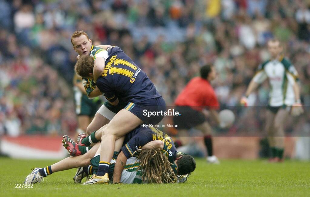 5 November 2006; Brendan Coulter and Paul Galvin, Ireland, tussle with Chance Bateman and Justin Sherman, 11, Australia, as the referee throws the ball in to start the game. Coca-Cola International Rules Series 2006, Second Test, Ireland v Australia, Croke Park, Dublin. Picture credit: Brendan Moran / SPORTSFILE