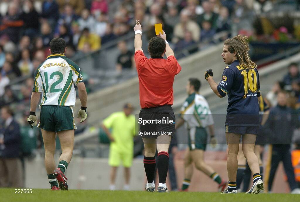 5 November 2006; Referee Shane McInerney shows a yellow card to Paul Galvin, Ireland, and Chance Bateman, Australia. Coca-Cola International Rules Series 2006, Second Test, Ireland v Australia, Croke Park, Dublin. Picture credit: Brendan Moran / SPORTSFILE