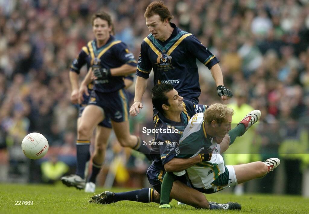 5 November 2006; Graham Geraghty, Ireland, is tackled by Danyle Pearse, Australia, before being stretchered off with an injury as a result of this tackle. Coca-Cola International Rules Series 2006, Second Test, Ireland v Australia, Croke Park, Dublin. Picture credit: Brendan Moran / SPORTSFILE