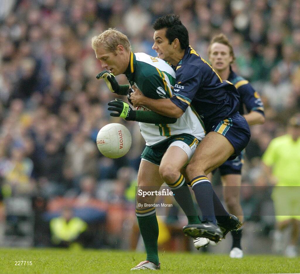5 November 2006; Graham Geraghty, Ireland, is tackled by Danyle Pearse, Australia, before being stretchered off with an injury as a result of this tackle. Coca-Cola International Rules Series 2006, Second Test, Ireland v Australia, Croke Park, Dublin. Picture credit: Brendan Moran / SPORTSFILE