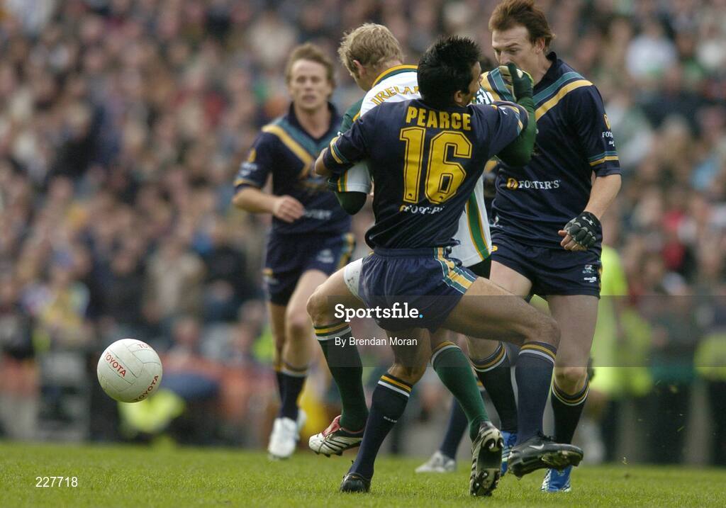 5 November 2006; Graham Geraghty, Ireland, is tackled by Danyle Pearse, Australia, before being stretchered off with an injury as a result of this tackle. Coca-Cola International Rules Series 2006, Second Test, Ireland v Australia, Croke Park, Dublin. Picture credit: Brendan Moran / SPORTSFILE