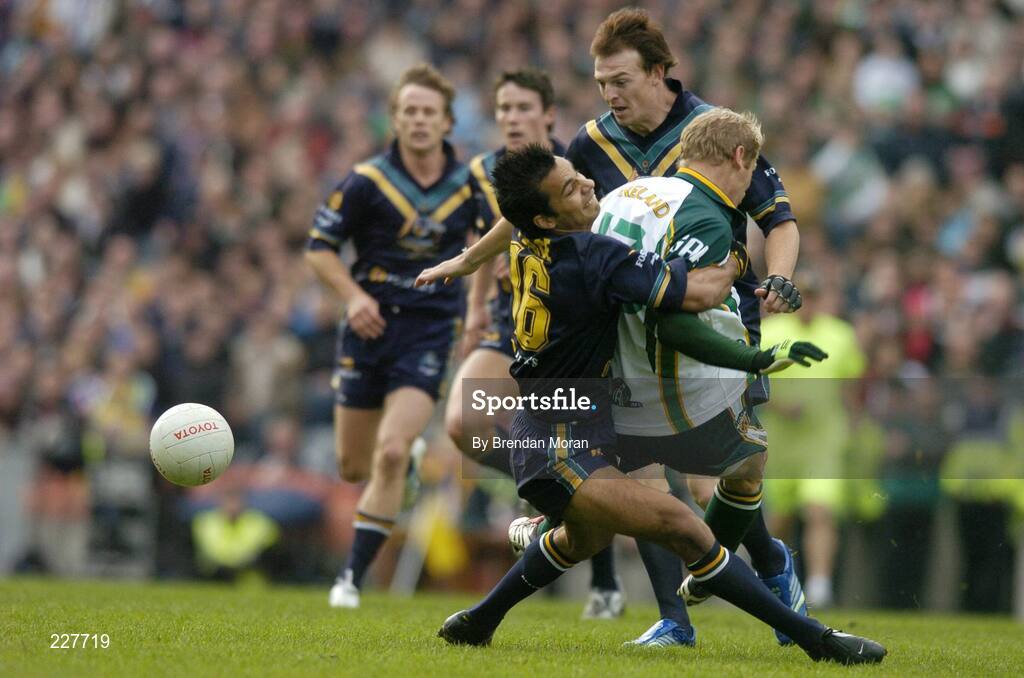 5 November 2006; Graham Geraghty, Ireland, is tackled by Danyle Pearse, Australia, before being stretchered off with an injury as a result of this tackle. Coca-Cola International Rules Series 2006, Second Test, Ireland v Australia, Croke Park, Dublin. Picture credit: Brendan Moran / SPORTSFILE