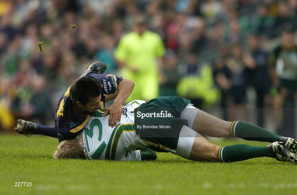 5 November 2006; Graham Geraghty, Ireland, is tackled by Danyle Pearse, Australia, before being stretchered off with an injury as a result of this tackle. Coca-Cola International Rules Series 2006, Second Test, Ireland v Australia, Croke Park, Dublin. Picture credit: Brendan Moran / SPORTSFILE
