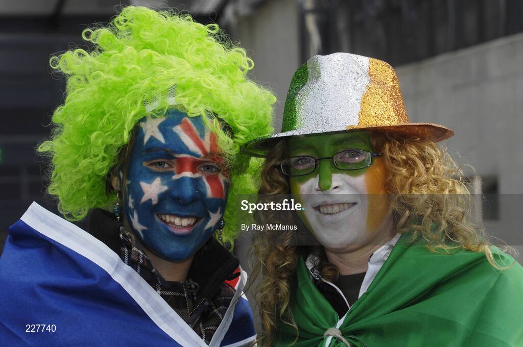 5 November 2006; Lana Roberts, left, Victoria, Australia, and Lorna Poole, Enniscorthy, Co. Wexford, Ireland, support a side each as they make their way to the game. Coca-Cola International Rules Series 2006, Second Test, Ireland v Australia, Croke Park, Dublin. Picture credit: Ray McManus / SPORTSFILE