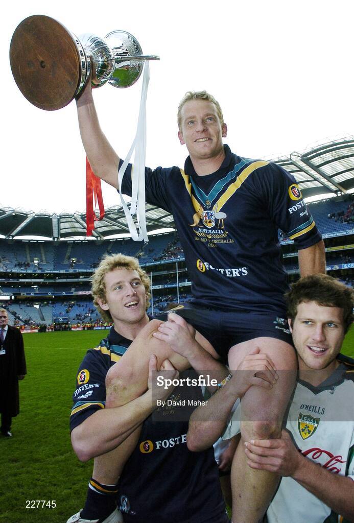 5 November 2006; Danyle Pearce, Australia, is carried shoulder high by his team-mate's Sam Fisher, left, and Brent Stanton, at the end of the game. Coca-Cola International Rules Series 2006, Second Test, Ireland v Australia, Croke Park, Dublin. Picture credit: David Maher / SPORTSFILE