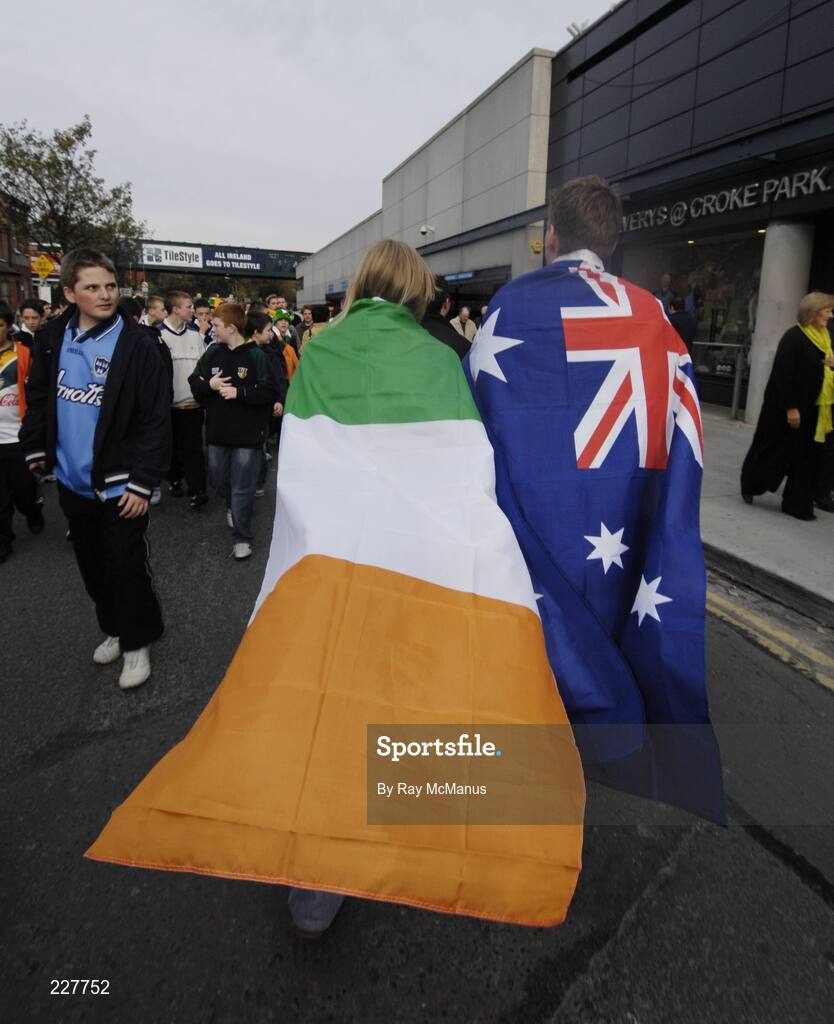5 November 2006; Fiona McCahey, Foxrock, Dublin, Ireland, and Martin MacDonald, Melbourne, Australia, support  a side each as they make their way to the game. Coca-Cola International Rules Series 2006, Second Test, Ireland v Australia, Croke Park, Dublin. Picture credit: Ray McManus / SPORTSFILE