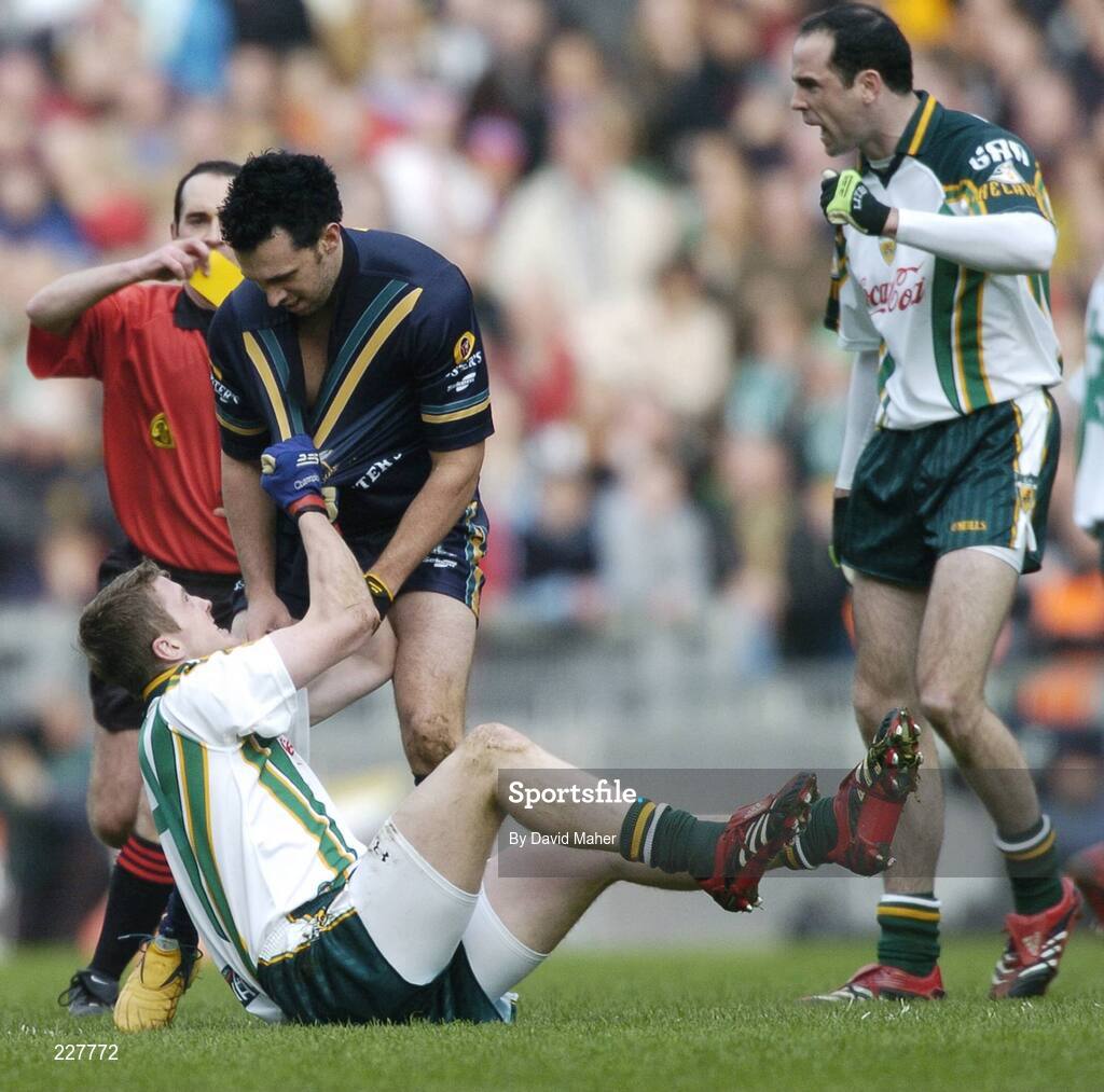 5 November 2006; Kevin Reilly, Ireland, pulls the jersey of Nick Davis, Australia, as referee David Coldrick moves in to issue a yellow to Nick Davis. Coca-Cola International Rules Series 2006, Second Test, Ireland v Australia, Croke Park, Dublin. Picture credit: David Maher / SPORTSFILE